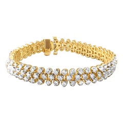 Bracelet tennis à trois rangées de diamants 4,05 cttw or jaune 14 carats