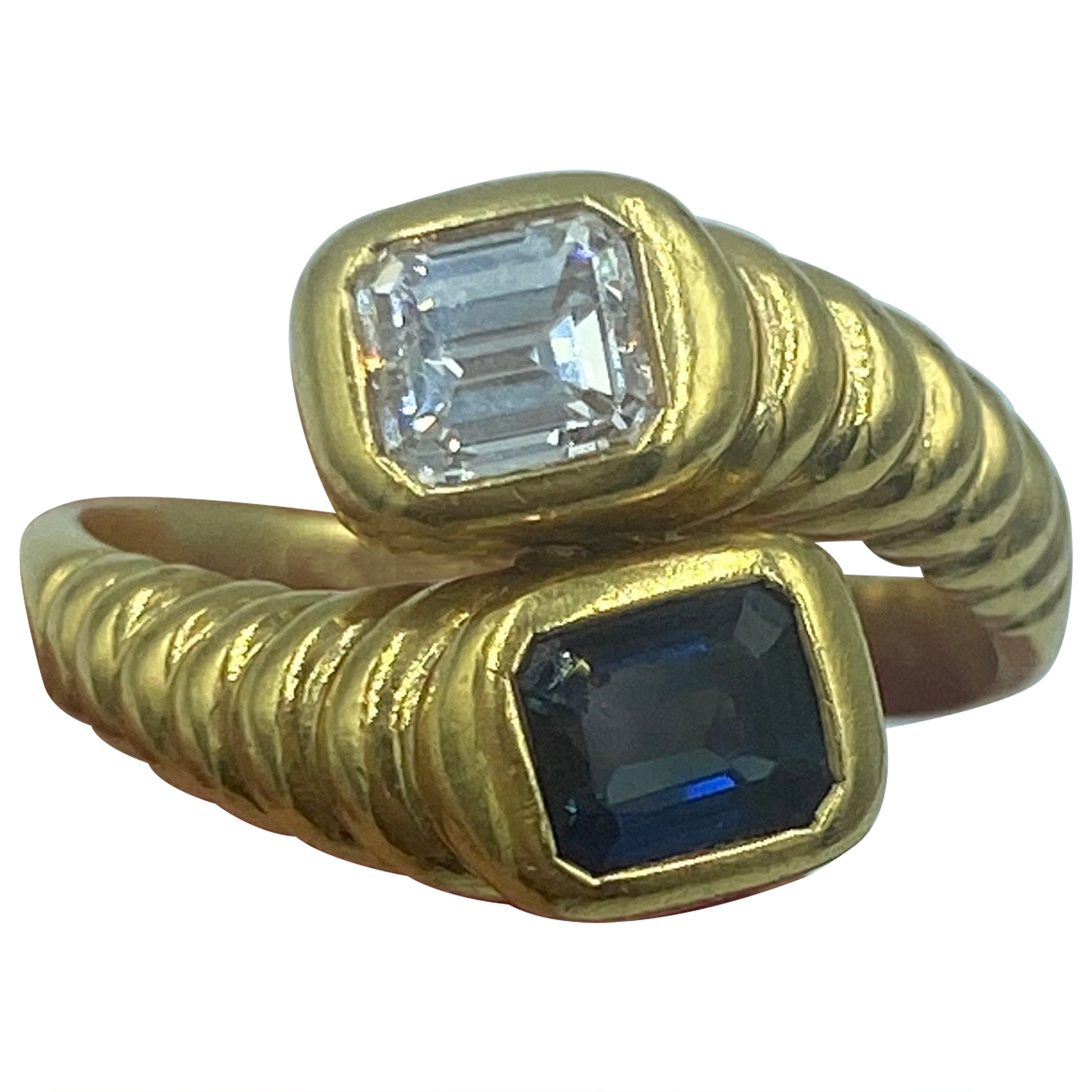 1970s 18 k gold and emerald cut diamond and sapphire toi et moi ring For Sale