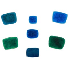 Ole Bjørn Krüger. Seven brooches in glazed stoneware in blue and green shades.