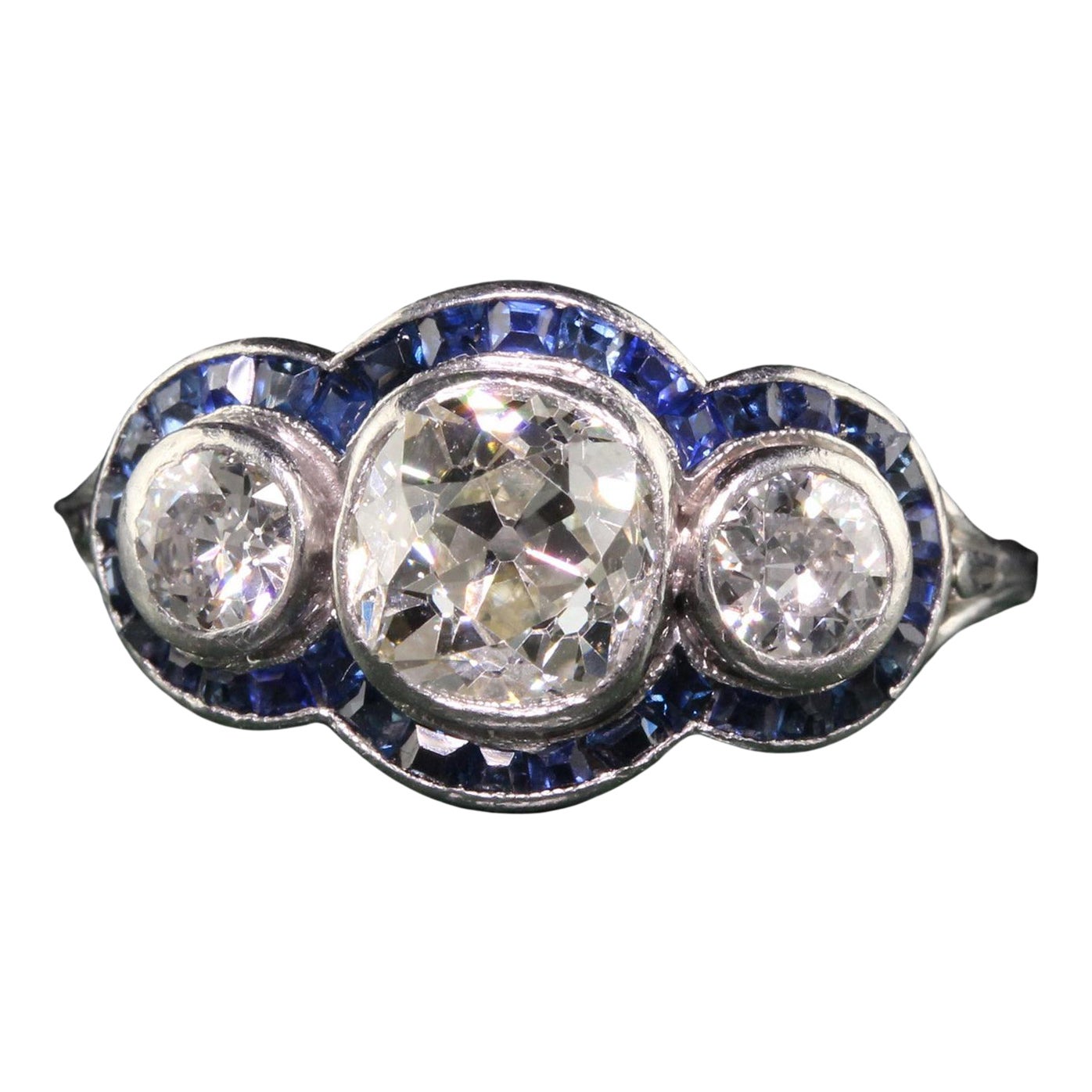 Antique Art Deco Platinum Old Mine Diamond and Sapphire Three Stone Ring For Sale