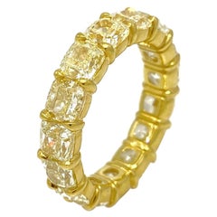 Light Yellow Cushion Diamond Eternity Ring 7.47 Carats in 18k Yellow Gold