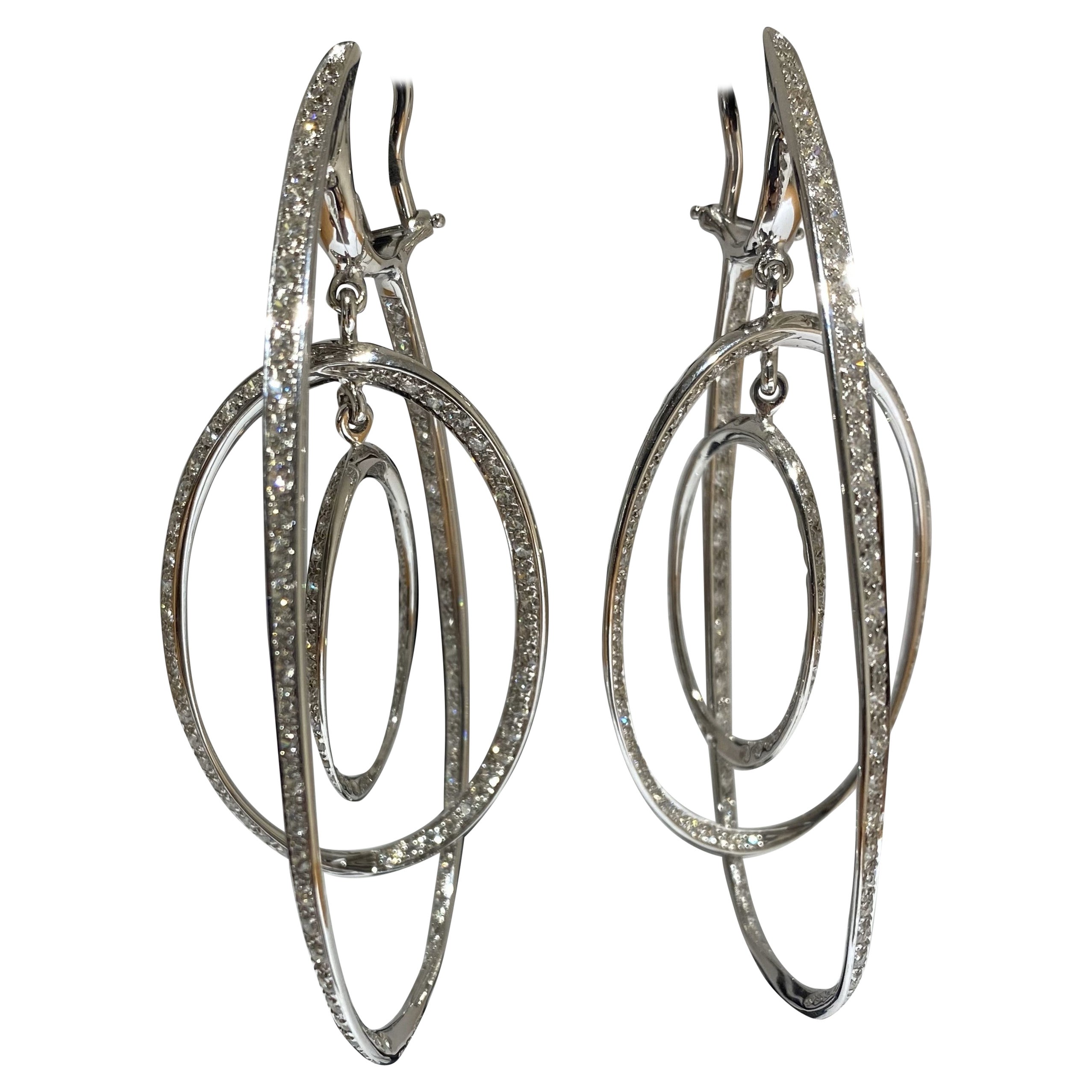 Introducing the ASTROLABIO Earrings by the renowned Italian master jeweler, Fulvio Maria Scavia. Meticulously crafted in Italy, these exquisite earrings showcase the unparalleled artistry of the designer. Fashioned in radiant white gold, the