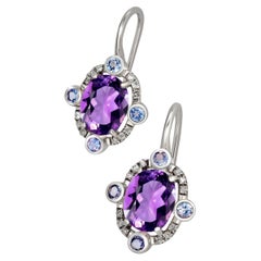 Boucles d'oreilles pendantes en or 14k avec améthystes.