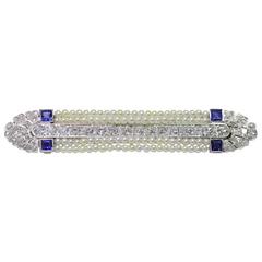 Platinum Art Deco Diamond, Sapphire and Seed Pearl Brooch