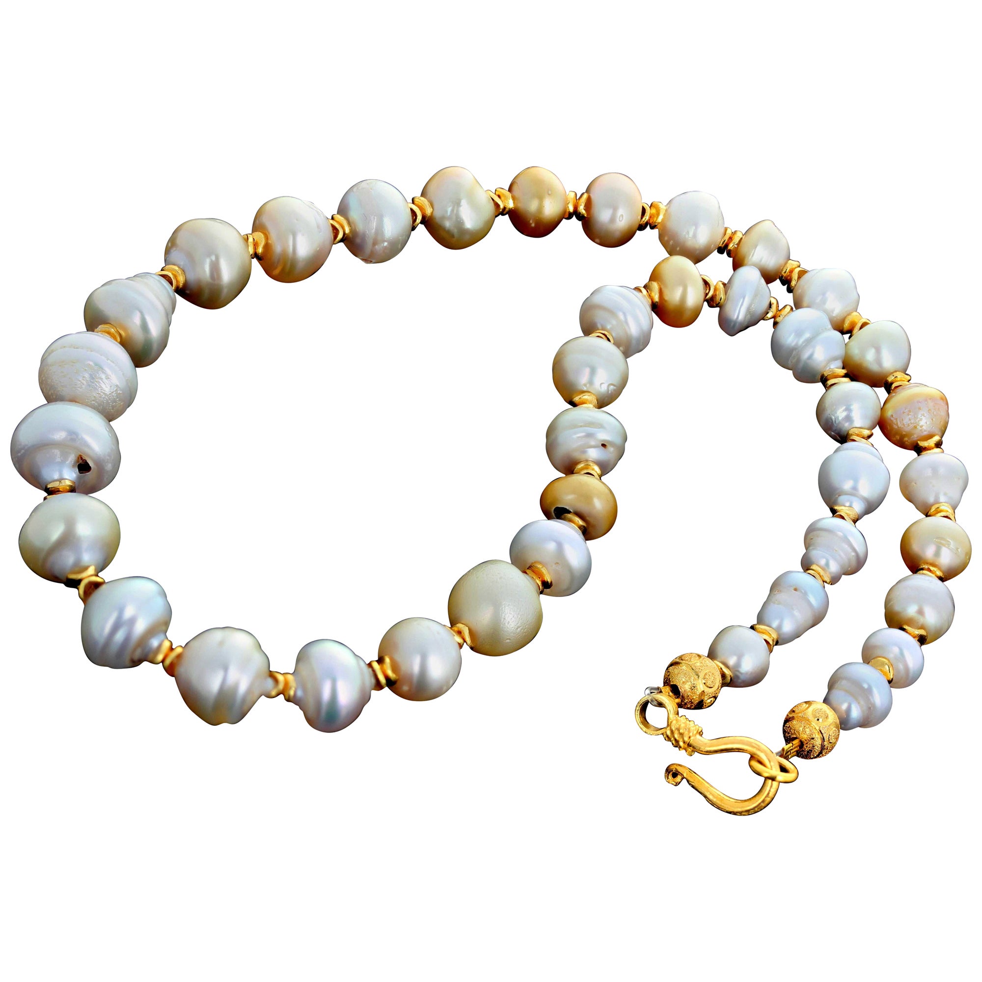 Absolutely gorgeous natural real Tahitian Ocean Pearls  create this magnificent Pearl necklace.  The largest Pearl is 14.8mm.  The gold plated spacers enhance the glowing of all of the slightly different colors of these beautiful white/creamy/gold