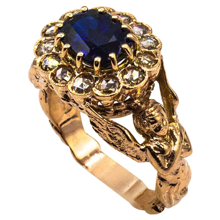 Bague cocktail de style Art Nouveau en or jaune avec diamants blancs et saphirs bleus taille ovale