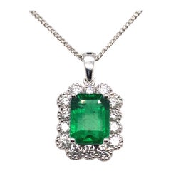 Emerald and Diamond Cluster Pendant 18 Karat White Gold