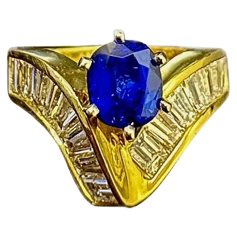 Bague de fiançailles en or jaune 18 carats avec diamant baguette et saphir bleu taille coussin