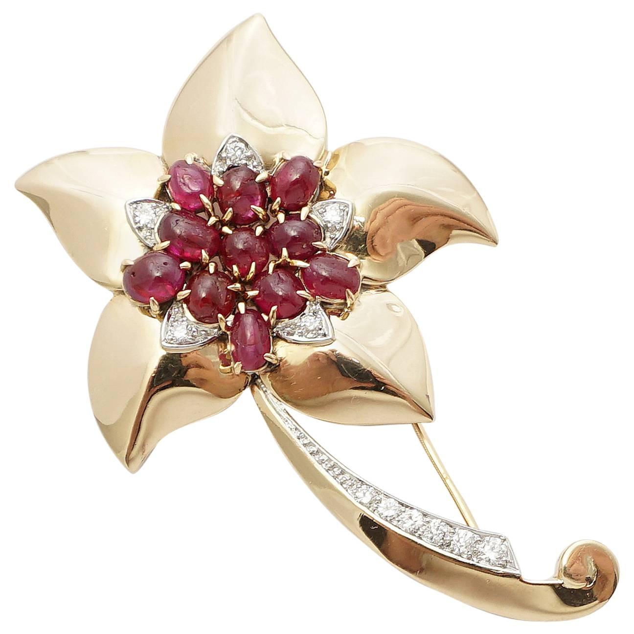 A beautiful retro period mid century Marcus and Company flower form brooch. Adorned with rubies and diamonds, this fantastic brooch is a superb example of the ultra high quality workmanship that Marcus has long been regarded for.

Featuring a total