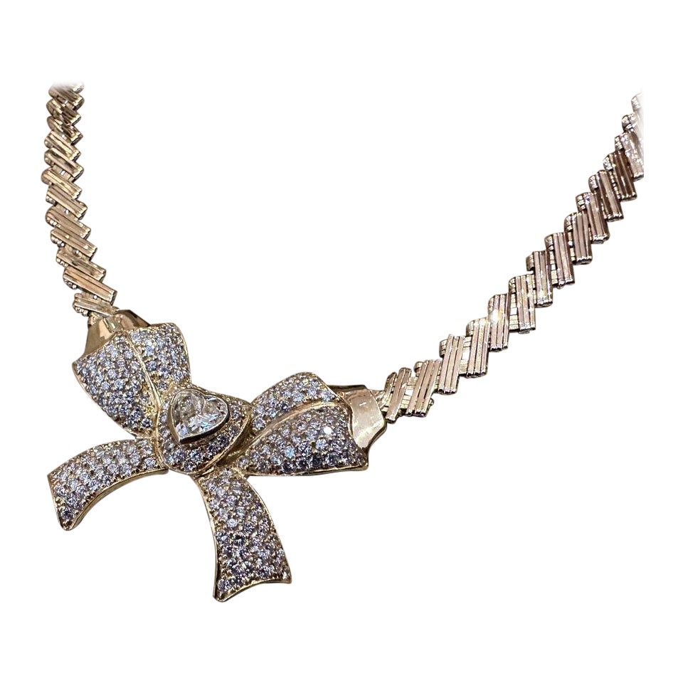 Diamond Bow Necklace with .99 Carat Heart Diamond in 18k Yellow Gold For Sale