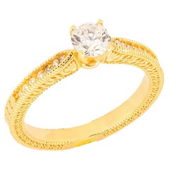 1 ct moissanite 14k gold engagement ring.