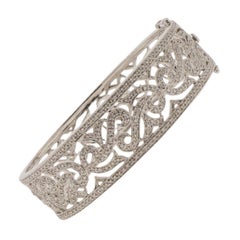 Bracciale con diamanti con cerniera a volute in oro bianco 18 carati