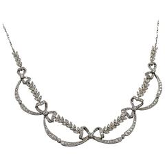 Edwardian Platinum And Diamond Bow and Leaf Motif Necklace