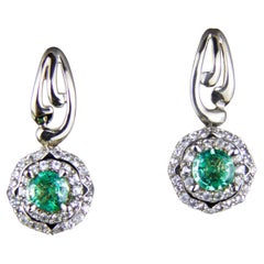 Emeralds 14k gold earrings studs.  