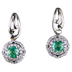 Emeralds 14k gold earrings studs.