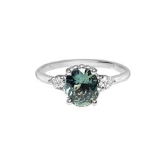 Bague de fiançailles avec saphir vert ovale et diamants
