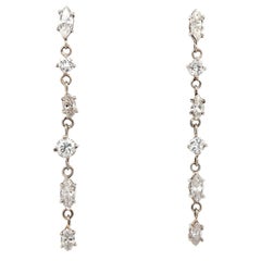 1.56ct mismatched drop diamond earrings, round and marquise brilliant cuts 