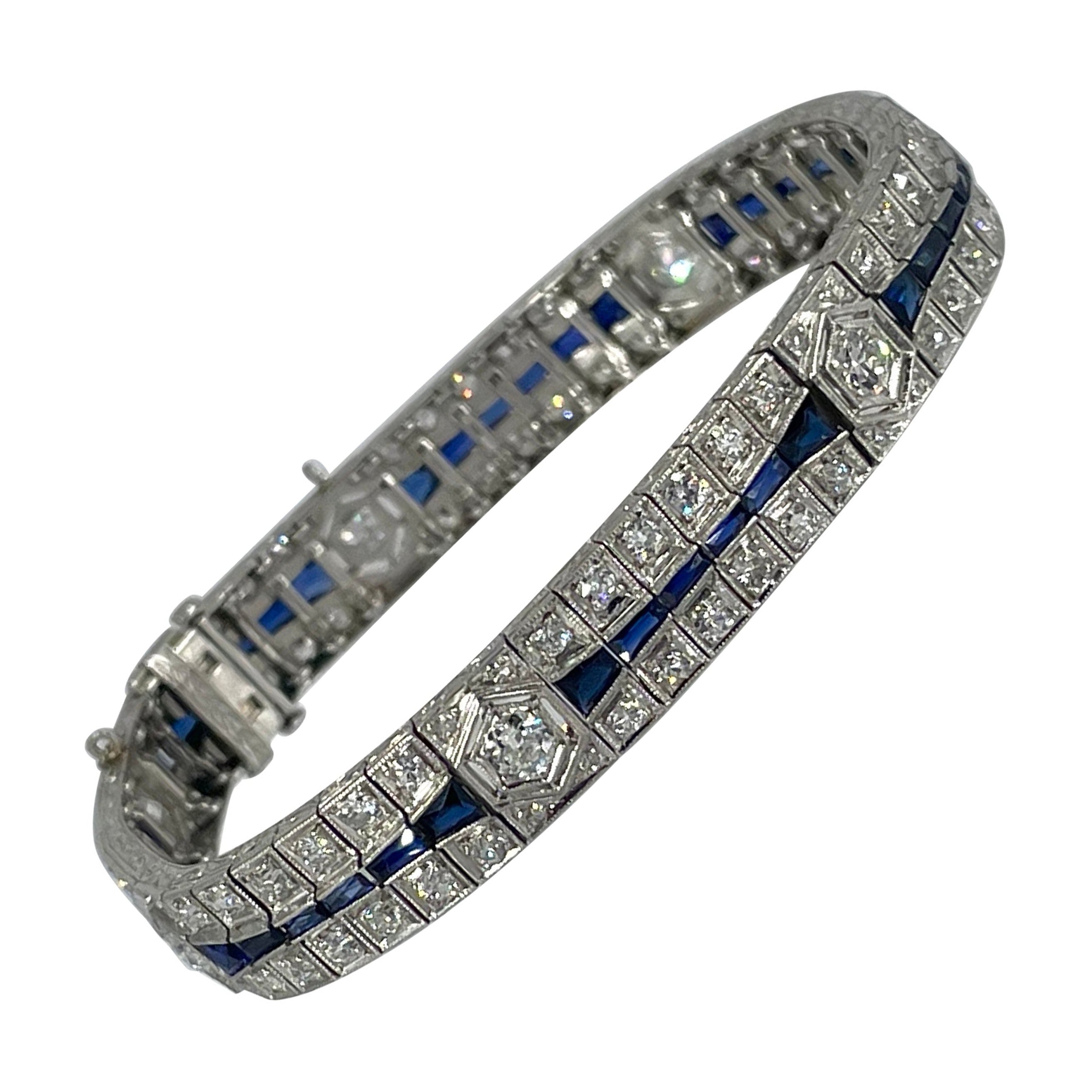 Charming Art Deco Three Row Diamond and Sapphire Bracelet in Platinum For Sale