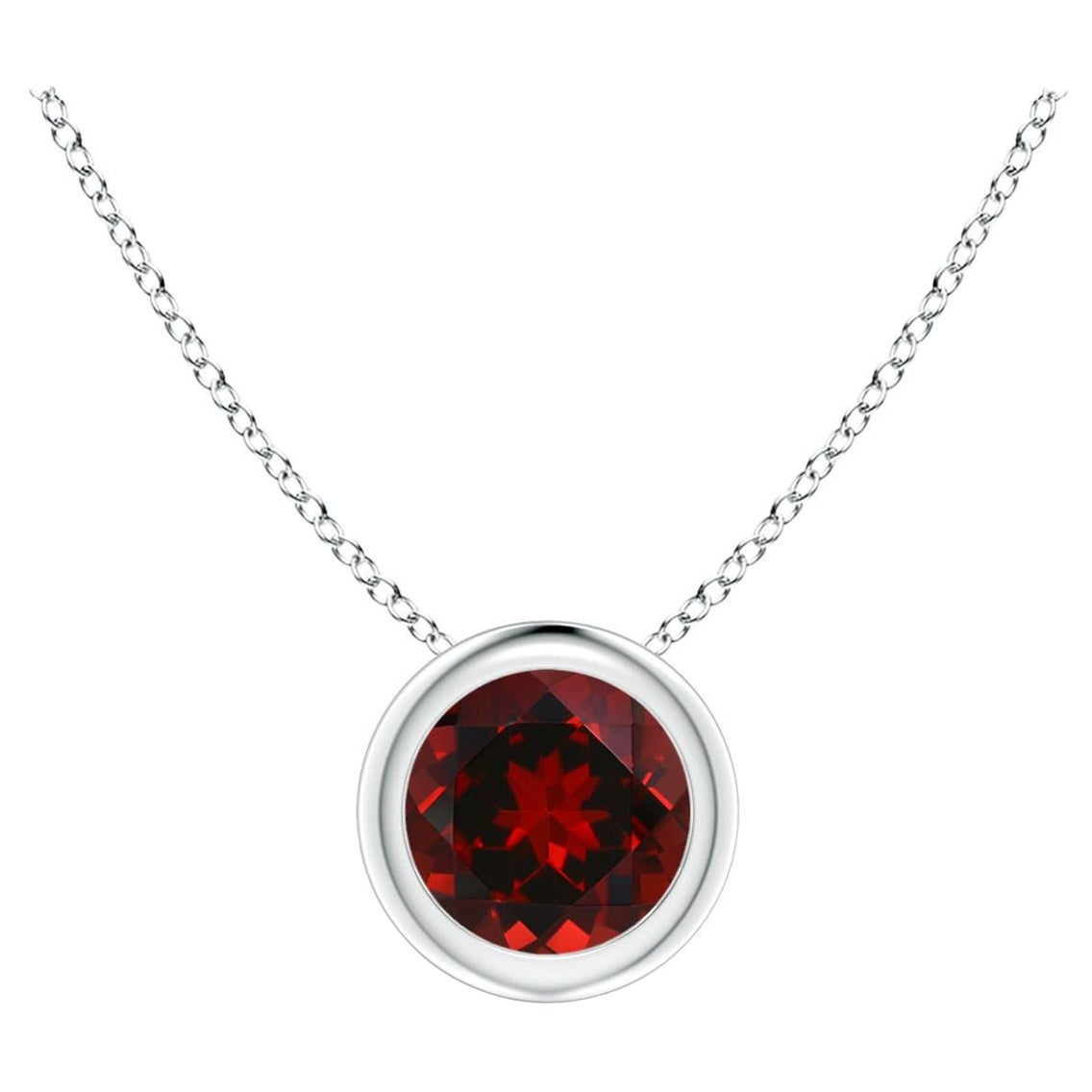 Pendentif solitaire rond en platine serti d'un grenat naturel de 0,60 carat