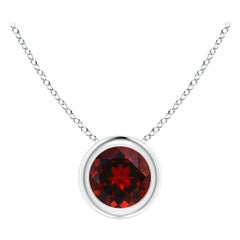 Pendentif solitaire rond en platine serti d'un grenat naturel de 0,60 carat