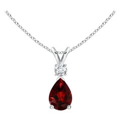 Colgante lágrima de granate natural de 0,85 ct con diamante en platino