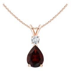 Colgante lágrima de granate natural de 1,3 ct con diamante en oro rosa de 14 quilates
