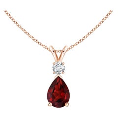 Colgante lágrima de granate natural de 0,85 ct con diamante en oro rosa de 14 quilates