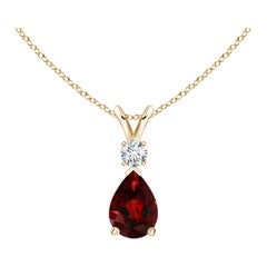 Colgante lágrima de granate natural de 0,85 ct con diamante en oro amarillo de 14 quilates