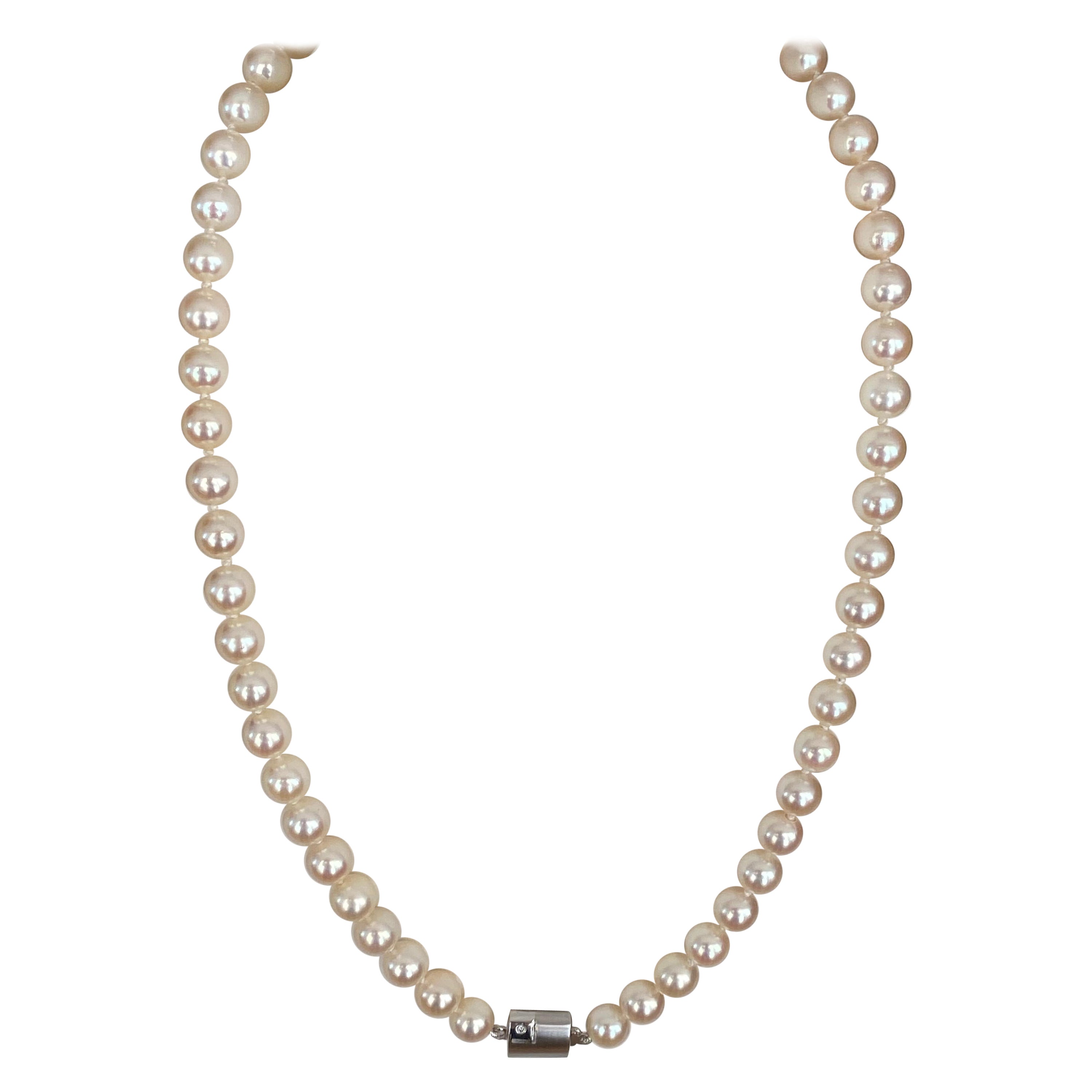 Akoya pearl necklace with 18 kt white gold clasp and one diamond For Sale