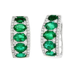 White gold earrings with brilliants and emeralds