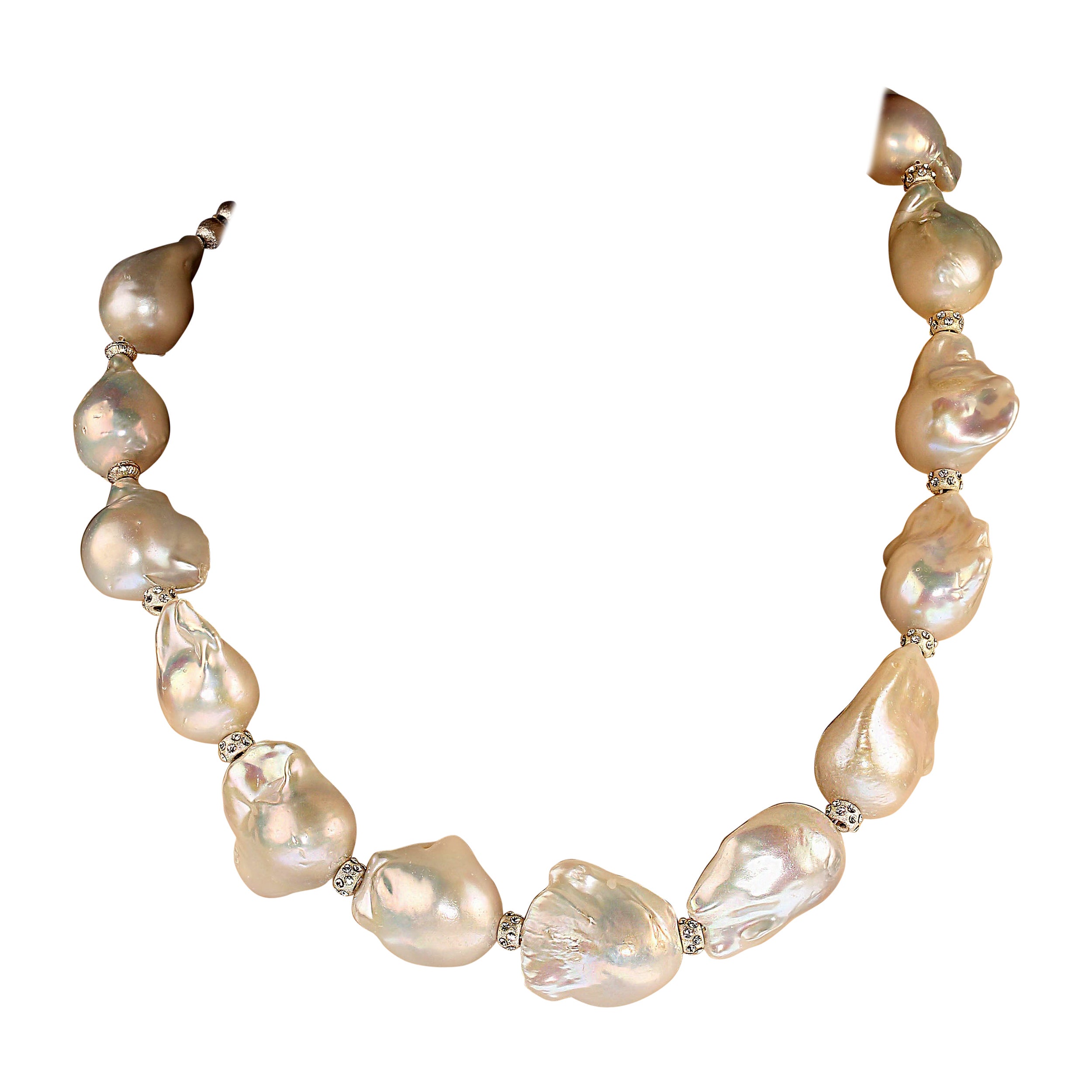 19-Inch glorious giant white baroque pearl necklace with sparkling crystal accents.  This fabulous necklace will be your 'go to' necklace favorite from your first wearing. The large, 16-19 MM iridescent pearls will entrance you.  Each is its own