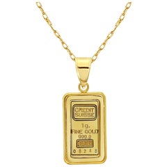 Barre d'or du Credit Suisse de 1 gramme avec lunette polie en or jaune 14k