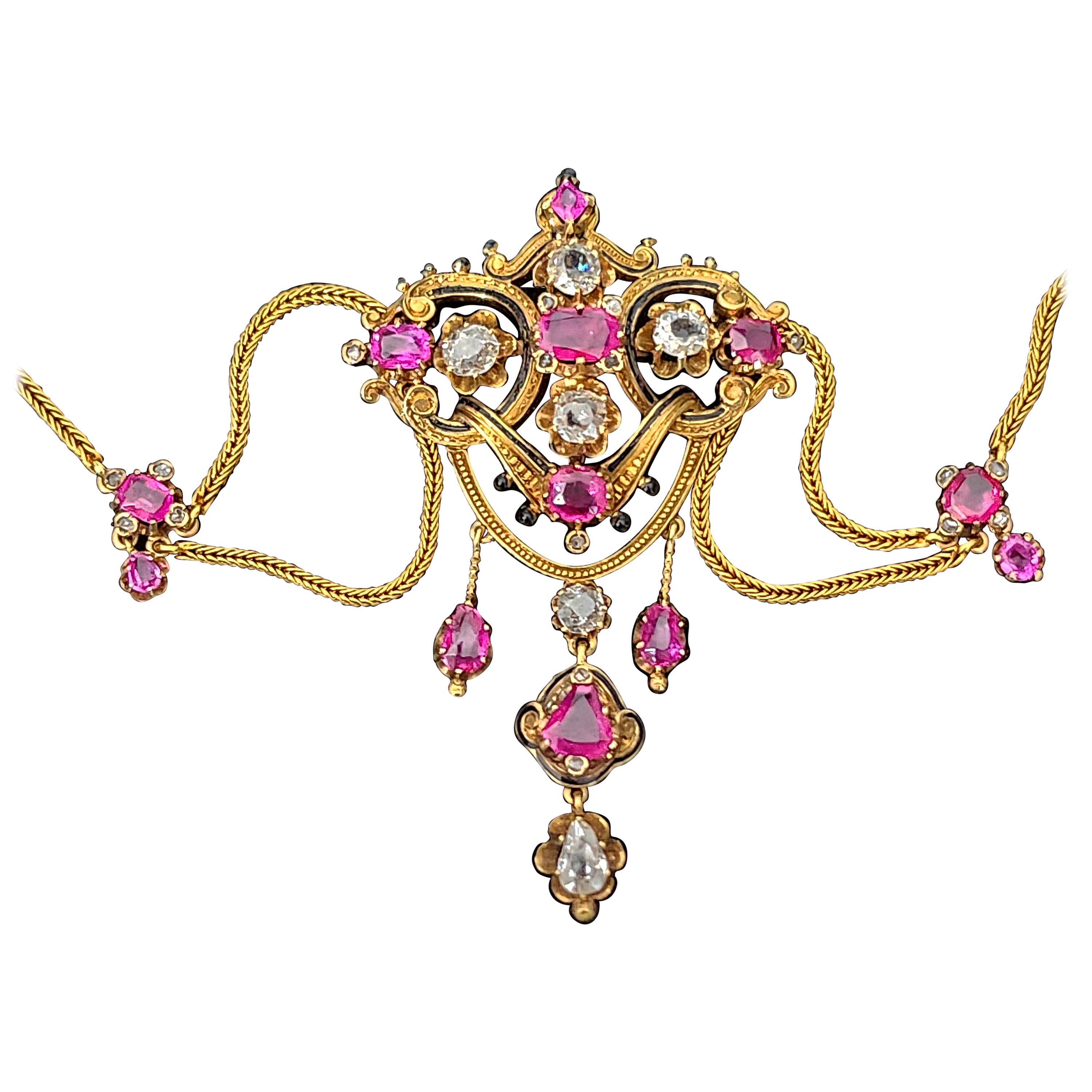 Antique 19th century art nouveau necklace in 18k gold with an estimate natural rubies of 6 carats and old mine cut diamonds 3.5 carats white color no inclousions decorted with black enamel in excellent condition