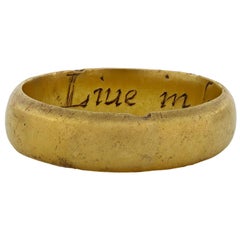 Bague postiche post-médiévale " Live in love and love in god * ", vers le 17e siècle.  