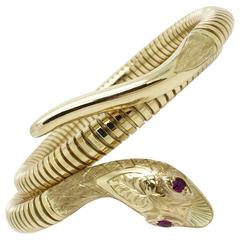 Gold Snake Coil Bracelet with Ruby Eyes