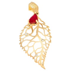 Leaf pendant with ruby and diamonds. 