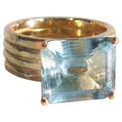 6.86 Carat Aquamarine in 18 Karat Gold Four-Band Ring