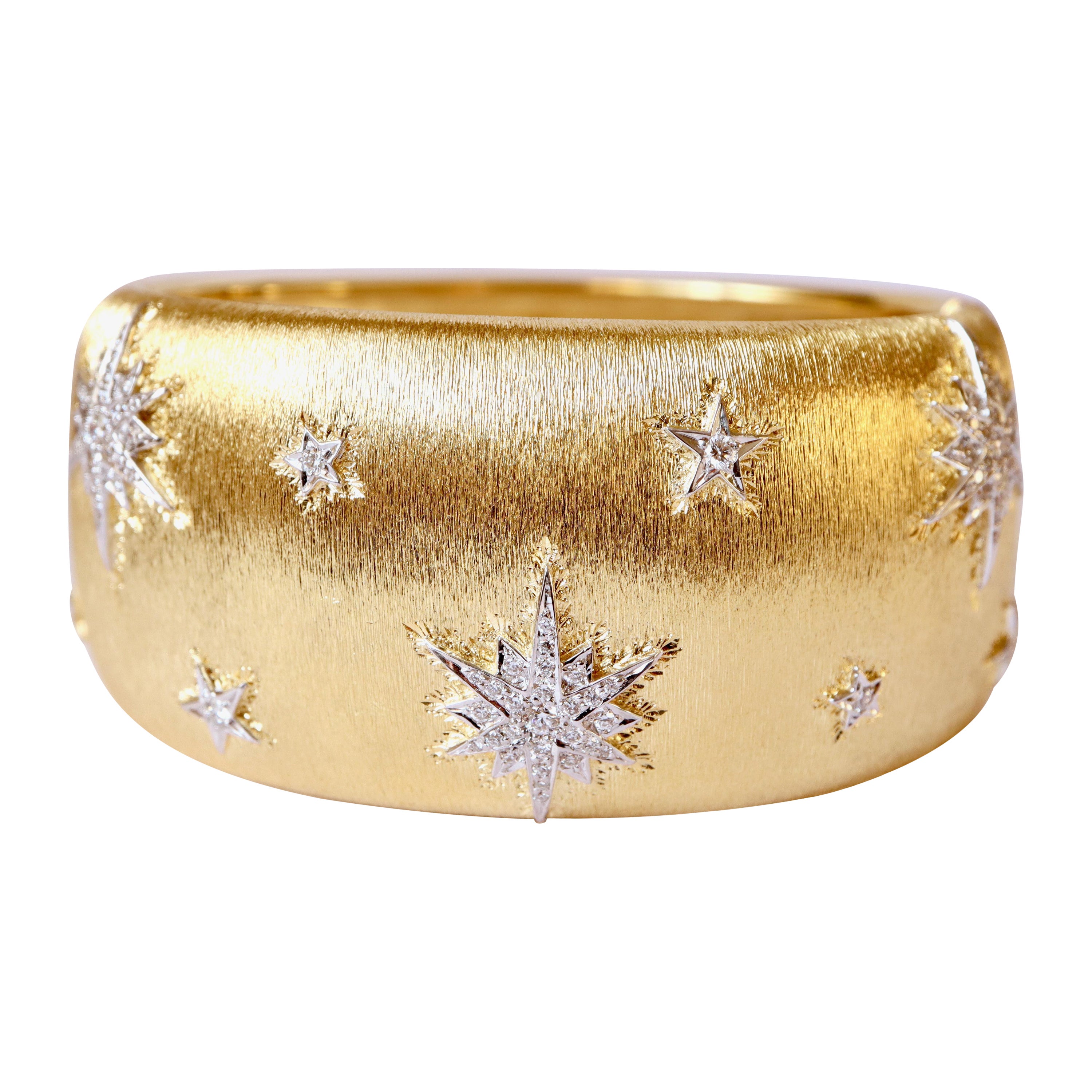 Bracelet de style Buccellati en or jaune et or blanc avec étoiles 