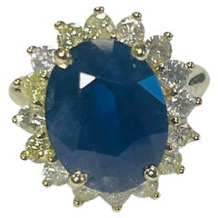 8.71 Carat Intense Blue Oval Cut Sapphire 14K Yellow Gold Diamond Ring
