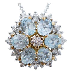 Collier pendentif en or blanc 18 carats, topaze de couleur aigue-marine et diamants