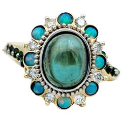 Bague asymétrique style halo en or 14 carats, opale, tsavorite, diamant et tourmaline