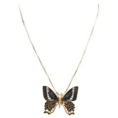 Schmetterling in Gold und Emaille. Doppelte Funktion