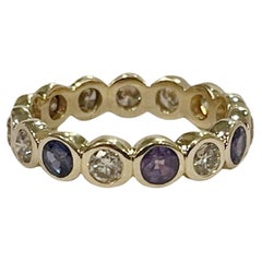 Alexandrite & Diamond eternity band 18KT gold