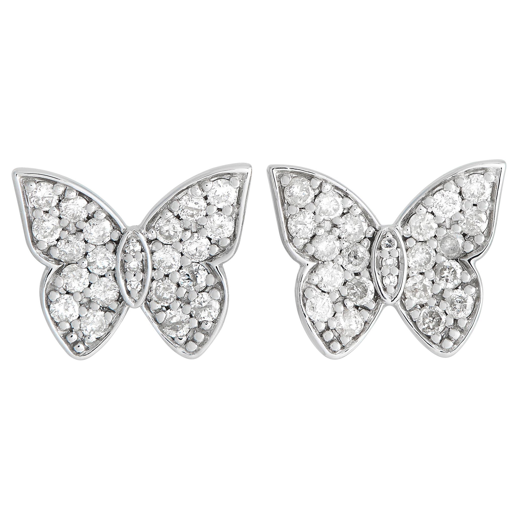 Clous d'oreilles papillon en or blanc 14 carats et diamants 0,50 carat