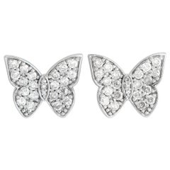 Clous d'oreilles papillon en or blanc 14 carats et diamants 0,50 carat