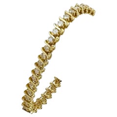 14 Karat Yellow Gold and Natural Diamond S Link Tennis Bracelet 