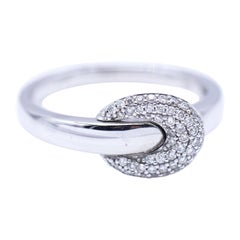 Bague à boucle en or blanc et diamants