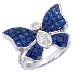 Used Mystery Invisible set Blue sapphire & diamonds on a butterfly ring