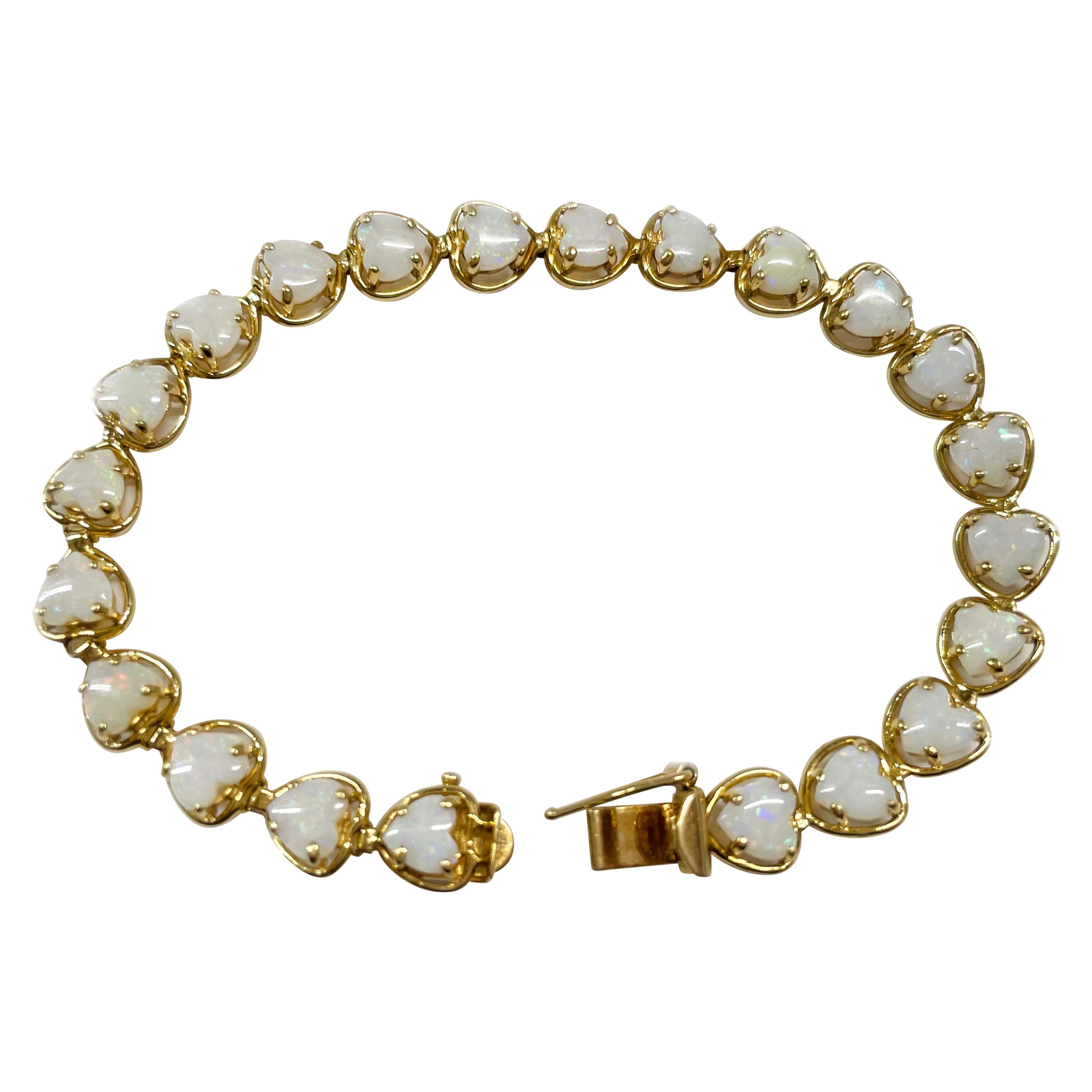 Bracelet cœur en or jaune et opale en vente