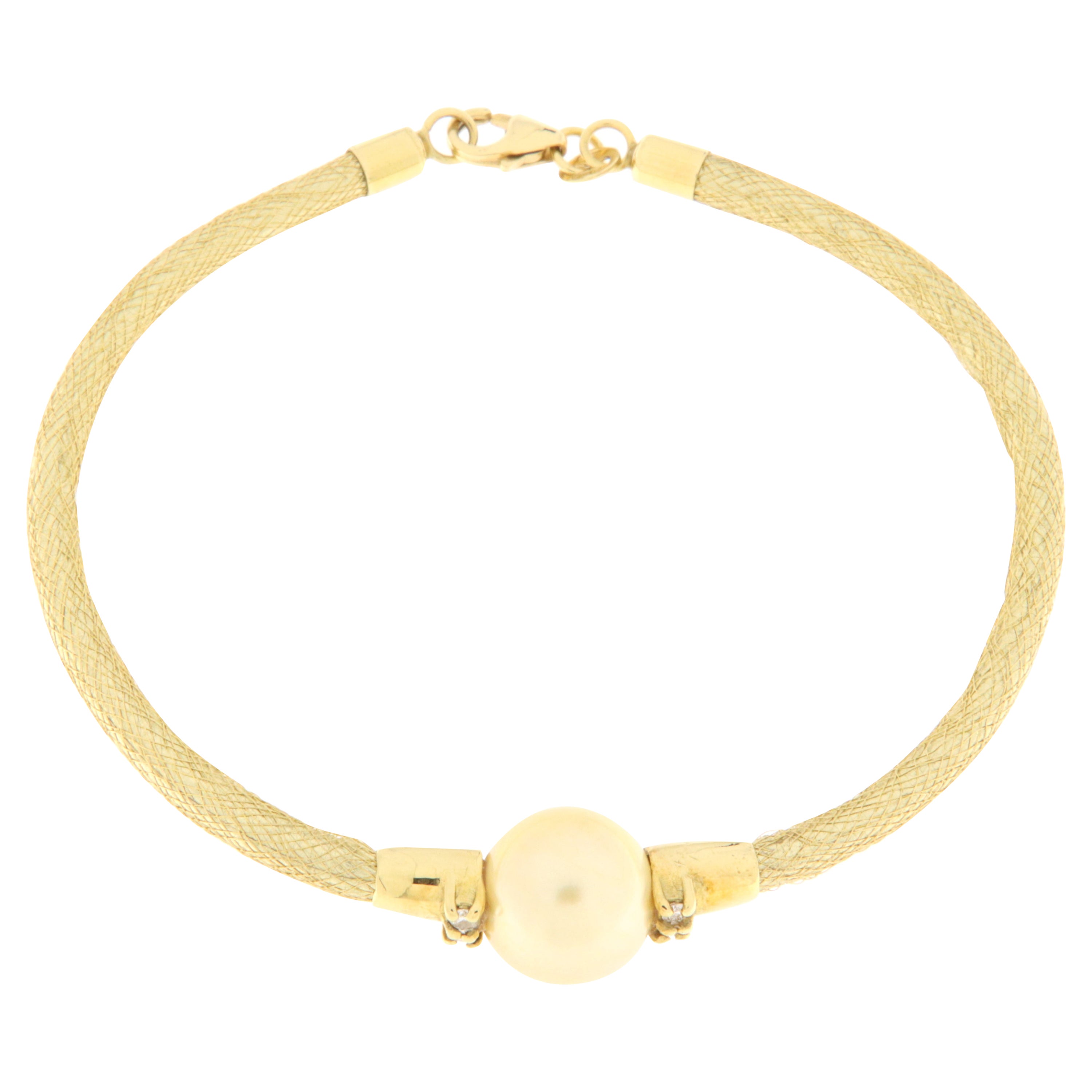 Yellow gold semirigid bracelet with diamonds and gold pearl For Sale
